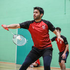 Two badminton players in the Sports Hall at the Indoor Sports Centre. Links to Badminton club page on Bristol SU Website